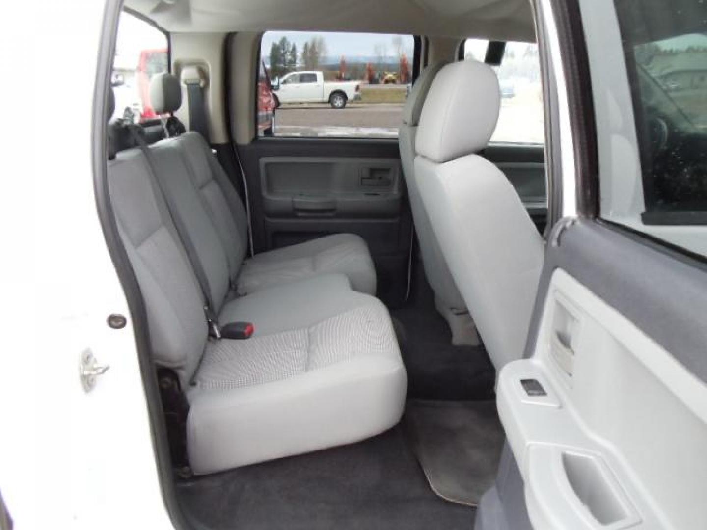 2010 White /Grey Dodge Dakota Bighorn (1D7RW3GP2AS) with an 4.7L V8 SOHC 16V FFV engine, 5-Speed Automatic transmission, located at 5465 Highway 2 W., Columbia Falls, MT, 59912, (406) 892-4407, 48.352188, -114.240929 - 4.7L V8 Cruise AC CD Tilt wheel Towing Power windows door locks and mirrors Brand new tires. - Photo#14