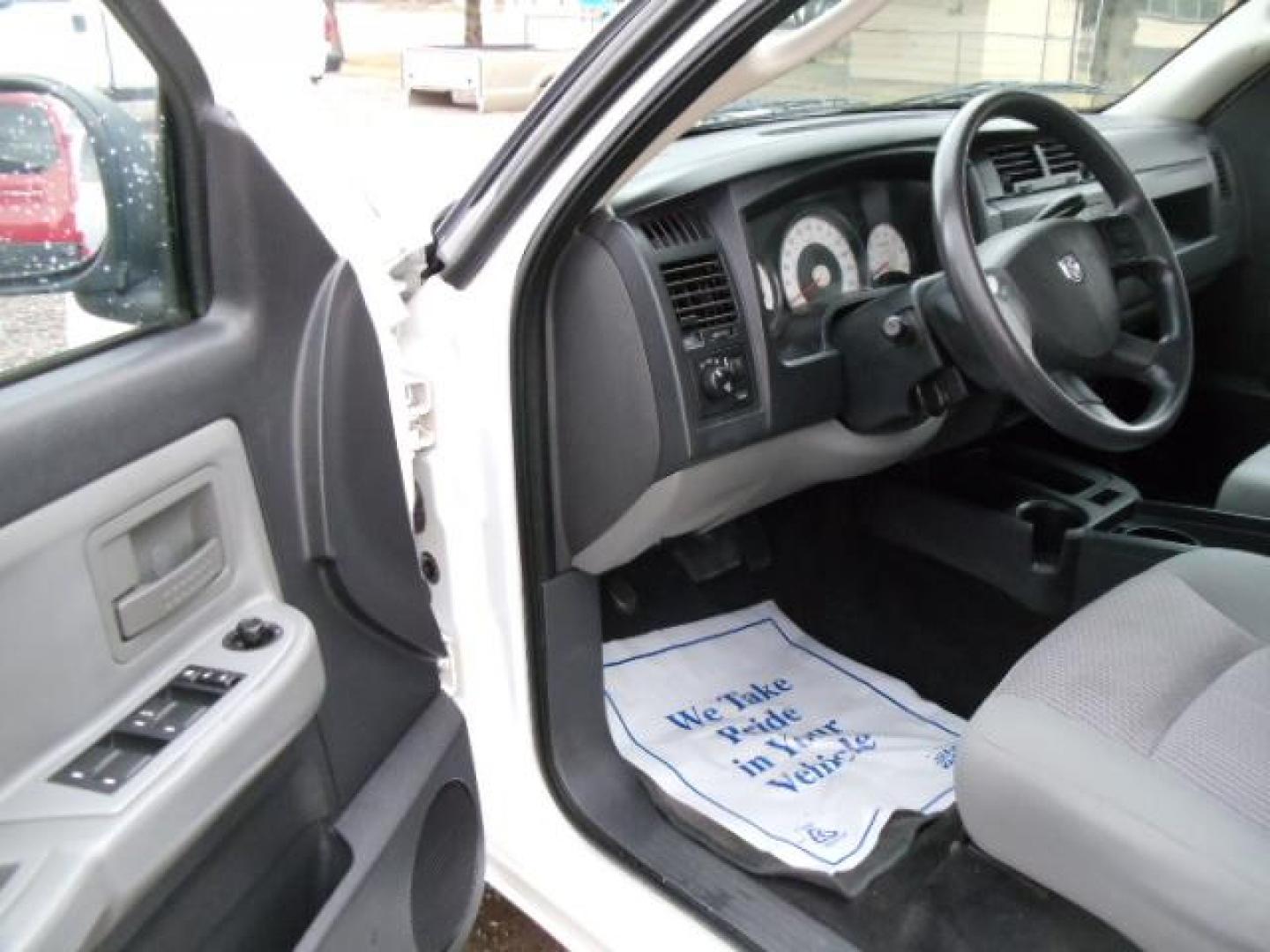 2010 White /Grey Dodge Dakota Bighorn (1D7RW3GP2AS) with an 4.7L V8 SOHC 16V FFV engine, 5-Speed Automatic transmission, located at 5465 Highway 2 W., Columbia Falls, MT, 59912, (406) 892-4407, 48.352188, -114.240929 - 4.7L V8 Cruise AC CD Tilt wheel Towing Power windows door locks and mirrors Brand new tires. - Photo#17