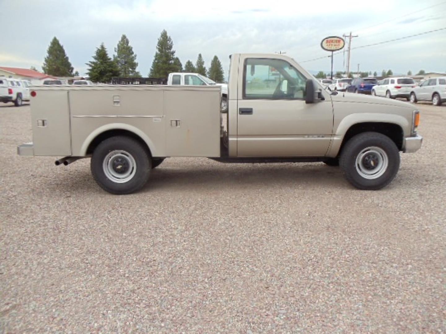 2000 Tan /Tan Chevrolet C/K 2500 Work Truck (1GBGK24R5YF) with an 5.7L V8 OHV 16V engine, Automatic transmission, located at 5465 Highway 2 W., Columbia Falls, MT, 59912, (406) 892-4407, 48.352188, -114.240929 - This truck is equipped with AC only 8 Foot Utility Box Good tires - Photo#9