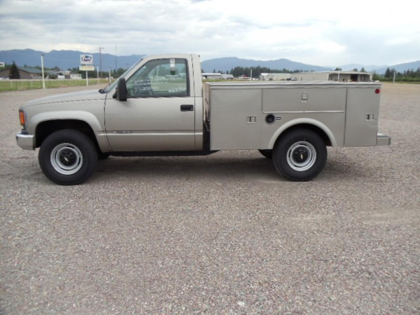 2000 Tan /Tan Chevrolet C/K 2500 Work Truck (1GBGK24R5YF) with an 5.7L V8 OHV 16V engine, Automatic transmission, located at 5465 Highway 2 W., Columbia Falls, MT, 59912, (406) 892-4407, 48.352188, -114.240929 - This truck is equipped with AC only 8 Foot Utility Box Good tires - Photo#3