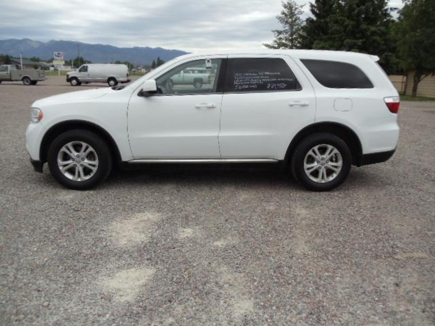 2013 White /Tan Dodge Durango SXT AWD (1C4RDJAG8DC) with an 3.6L V6 DOHC 24V engine, 5-Speed Automatic transmission, located at 5465 Highway 2 W., Columbia Falls, MT, 59912, (406) 892-4407, 48.352188, -114.240929 - Keyless entry Cruise control AC MP3 Tilt wheel Power windows door locks and mirrors Near new tires Front and rear heat and AC - Photo#3