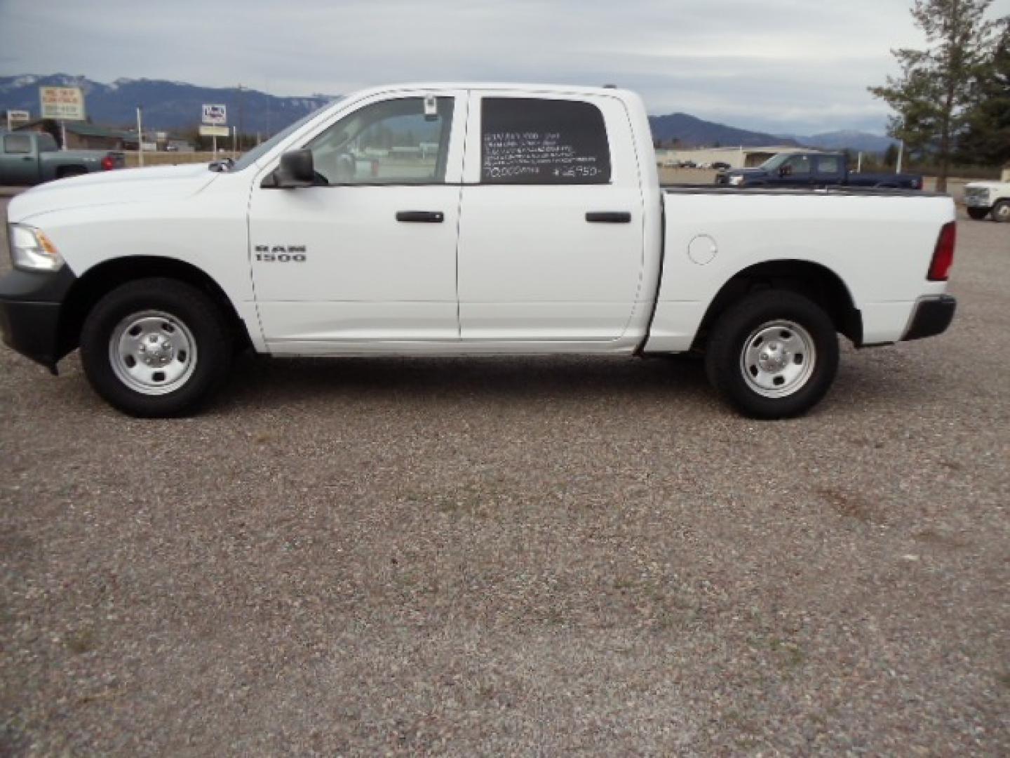 2014 White /Gray RAM 1500 Tradesman Crew Cab SWB 4WD (1C6RR7KG5ES) with an 3.6L V6 DOHC 24V FFV engine, 6-Speed Automatic transmission, located at 5465 Highway 2 W., Columbia Falls, MT, 59912, (406) 892-4407, 48.352188, -114.240929 - Keyless entry, Power windows, Power door locks, Power mirrors, Cruise control, AC, MP3-CD, Towing, Tilt steering wheel. This vehicle was previously owned by the federal government so it has been well maintained and taken care of. The truck is very clean inside and out with good tires and low actua - Photo#3