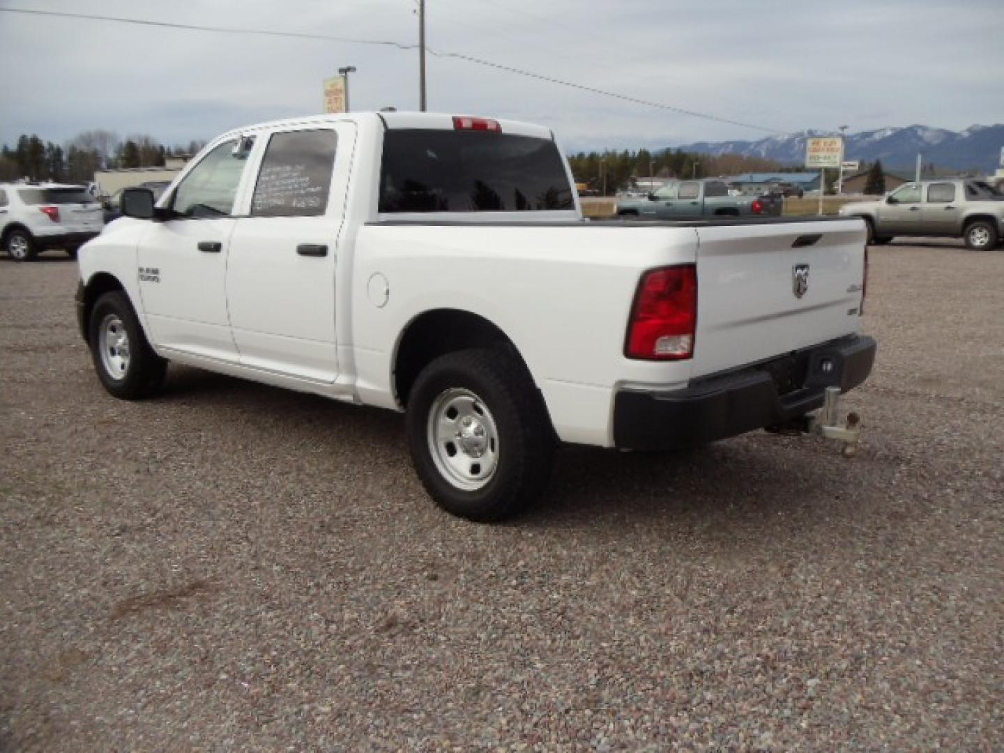 2014 White /Gray RAM 1500 Tradesman Crew Cab SWB 4WD (1C6RR7KG5ES) with an 3.6L V6 DOHC 24V FFV engine, 6-Speed Automatic transmission, located at 5465 Highway 2 W., Columbia Falls, MT, 59912, (406) 892-4407, 48.352188, -114.240929 - Keyless entry, Power windows, Power door locks, Power mirrors, Cruise control, AC, MP3-CD, Towing, Tilt steering wheel. This vehicle was previously owned by the federal government so it has been well maintained and taken care of. The truck is very clean inside and out with good tires and low actua - Photo#4