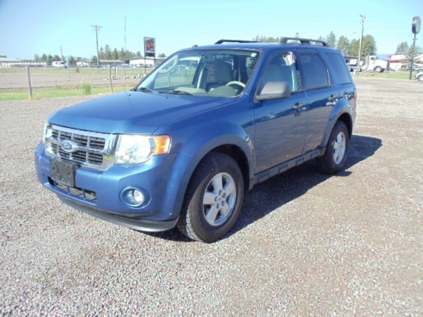 2010 Blue /Silver Ford Escape XLT 4WD (1FMCU9DGXAK) with an 3.0L V6 DOHC 24V engine, 6-Speed Automatic transmission, located at 5465 Highway 2 W., Columbia Falls, MT, 59912, (406) 892-4407, 48.352188, -114.240929 - Photo#2