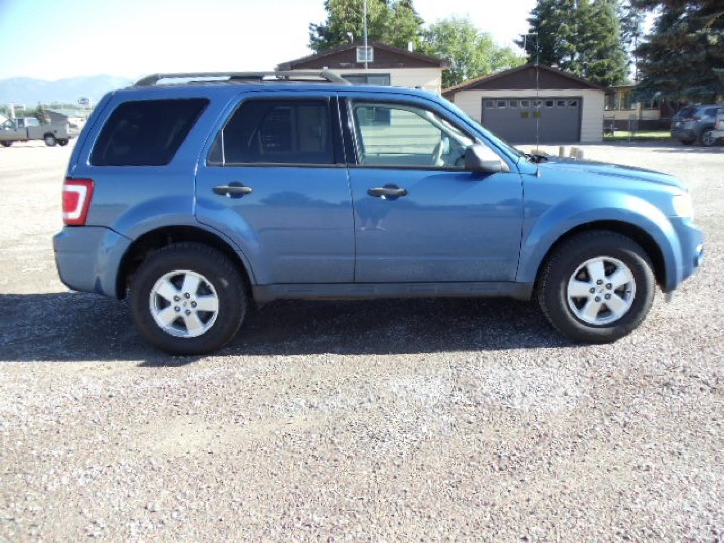 2010 Blue /Silver Ford Escape XLT 4WD (1FMCU9DGXAK) with an 3.0L V6 DOHC 24V engine, 6-Speed Automatic transmission, located at 5465 Highway 2 W., Columbia Falls, MT, 59912, (406) 892-4407, 48.352188, -114.240929 - Photo#7