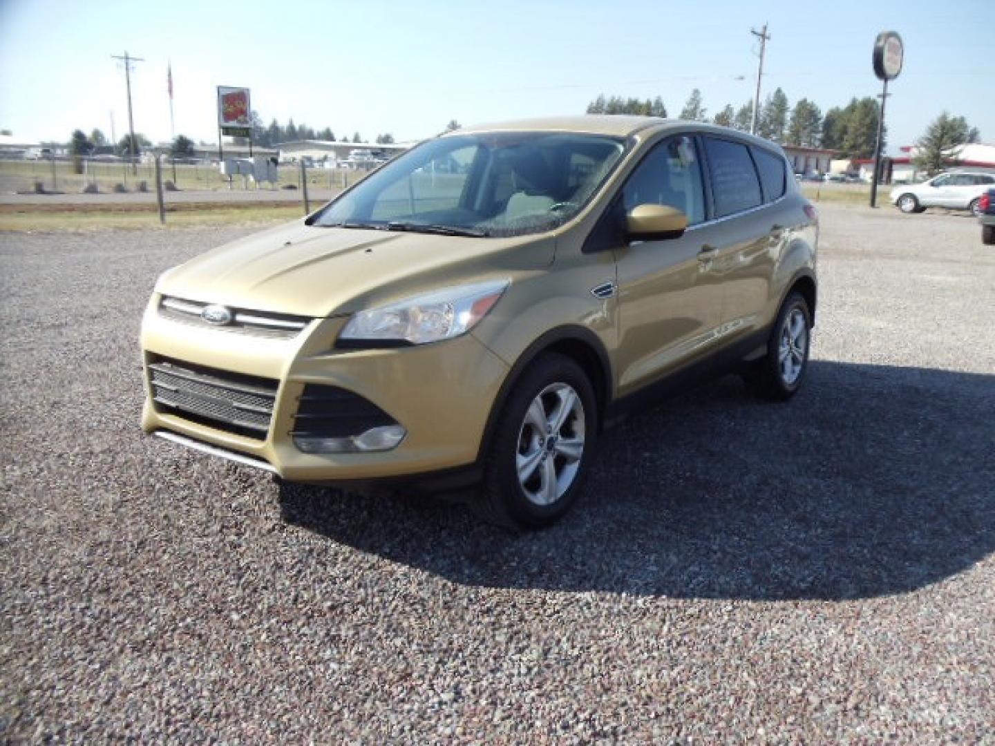 2015 Gold /Tan Ford Escape SE 4WD (1FMCU9G92FU) with an 2.0L L4 DOHC 16V engine, 6-Speed Automatic transmission, located at 5465 Highway 2 W., Columbia Falls, MT, 59912, (406) 892-4407, 48.352188, -114.240929 - Photo#2