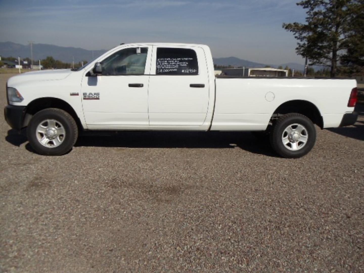 2014 White /Grey RAM 3500 Tradesman (3C63R3GT8EG) with an 5.7L V8 OHV 16V engine, 6-Speed Automatic transmission, located at 5465 Highway 2 W., Columbia Falls, MT, 59912, (406) 892-4407, 48.352188, -114.240929 - Photo#3