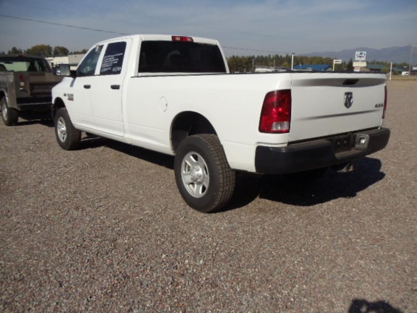 2014 White /Grey RAM 3500 Tradesman (3C63R3GT8EG) with an 5.7L V8 OHV 16V engine, 6-Speed Automatic transmission, located at 5465 Highway 2 W., Columbia Falls, MT, 59912, (406) 892-4407, 48.352188, -114.240929 - Photo#4