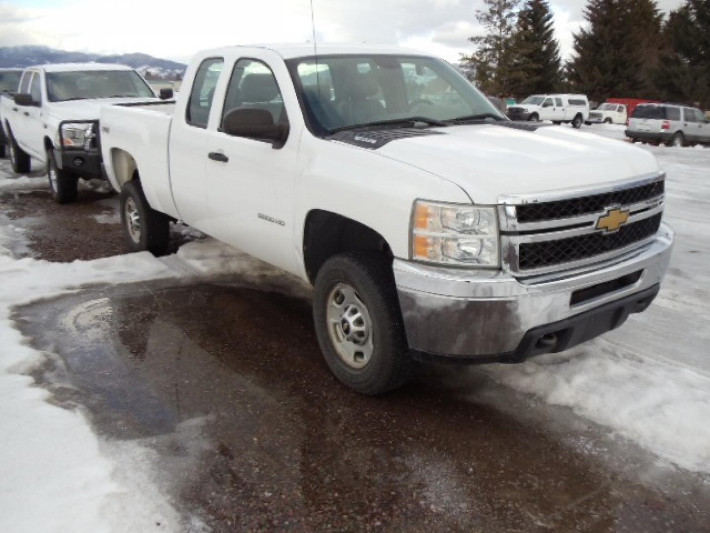 2012 White /Gray Chevrolet Silverado 2500HD Work Truck Ext. Cab 4WD (1GC2KVCG0CZ) with an 6.0L V8 OHV 16V FFV engine, 6-Speed Automatic transmission, located at 5465 Highway 2 W., Columbia Falls, MT, 59912, (406) 892-4407, 48.352188, -114.240929 - This truck was previously owned by the federal government so it has been well maintained and taken care of. This truck is very clean inside and out with good tires and low miles. This is the quad door short box with the 6.0L V8 gas motor. - Photo#0