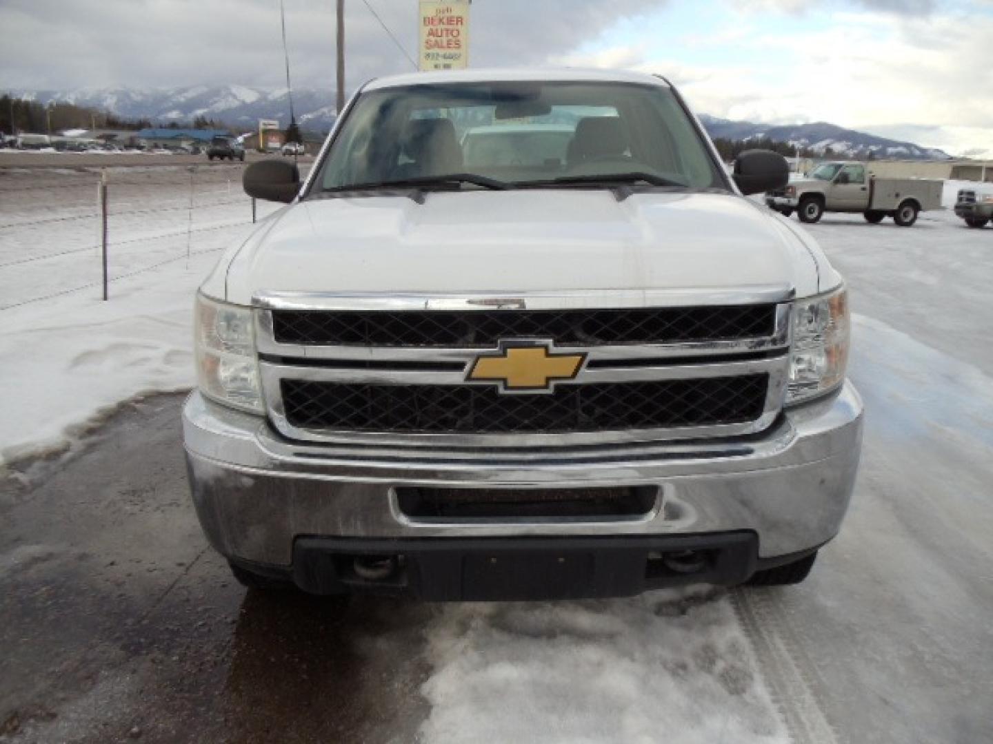 2012 White /Gray Chevrolet Silverado 2500HD Work Truck Ext. Cab 4WD (1GC2KVCG0CZ) with an 6.0L V8 OHV 16V FFV engine, 6-Speed Automatic transmission, located at 5465 Highway 2 W., Columbia Falls, MT, 59912, (406) 892-4407, 48.352188, -114.240929 - This truck was previously owned by the federal government so it has been well maintained and taken care of. This truck is very clean inside and out with good tires and low miles. This is the quad door short box with the 6.0L V8 gas motor. - Photo#1