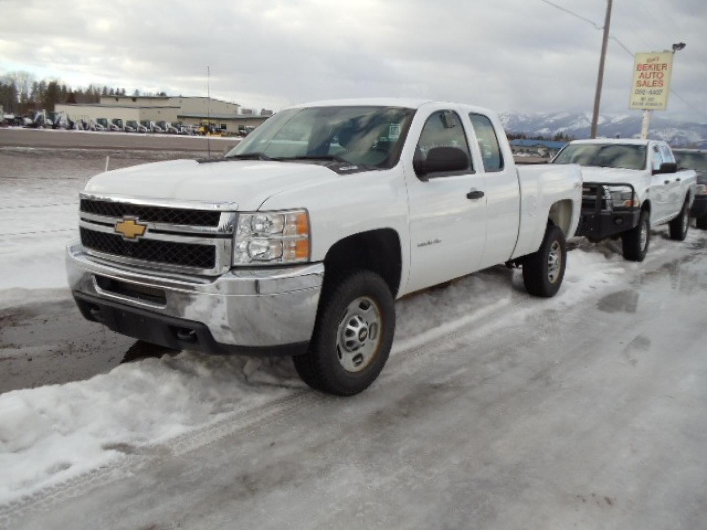 2012 White /Gray Chevrolet Silverado 2500HD Work Truck Ext. Cab 4WD (1GC2KVCG0CZ) with an 6.0L V8 OHV 16V FFV engine, 6-Speed Automatic transmission, located at 5465 Highway 2 W., Columbia Falls, MT, 59912, (406) 892-4407, 48.352188, -114.240929 - This truck was previously owned by the federal government so it has been well maintained and taken care of. This truck is very clean inside and out with good tires and low miles. This is the quad door short box with the 6.0L V8 gas motor. - Photo#2