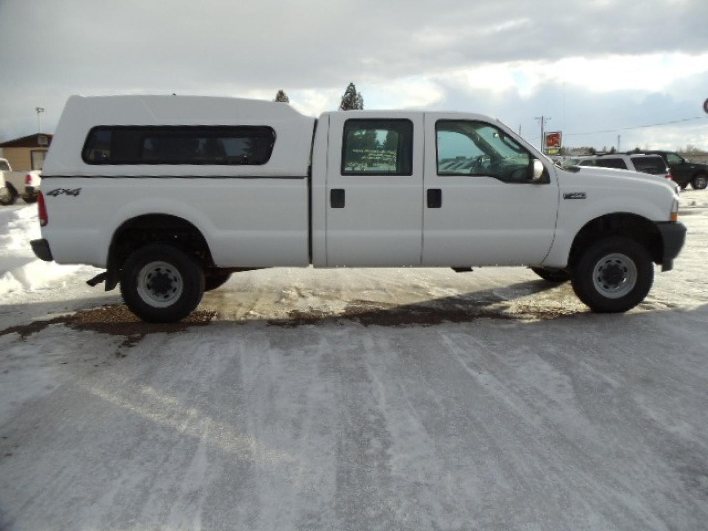 2004 Gray /Gray Ford F-350 SD XL Crew Cab 4WD (1FTSW31L04E) with an 5.4L V8 SOHC 16V engine, 6 Speed Manual transmission, located at 5465 Highway 2 W., Columbia Falls, MT, 59912, (406) 892-4407, 48.352188, -114.240929 - This truck was previously owned by the federal government so it has been well maintained and taken care of. The truck is clean inside and out with good tires and low actual miles. This is the crew cab long box with the 5.4L V8 gas motor. This vehicle is rare with the 6 speed manual transmission. - Photo#9