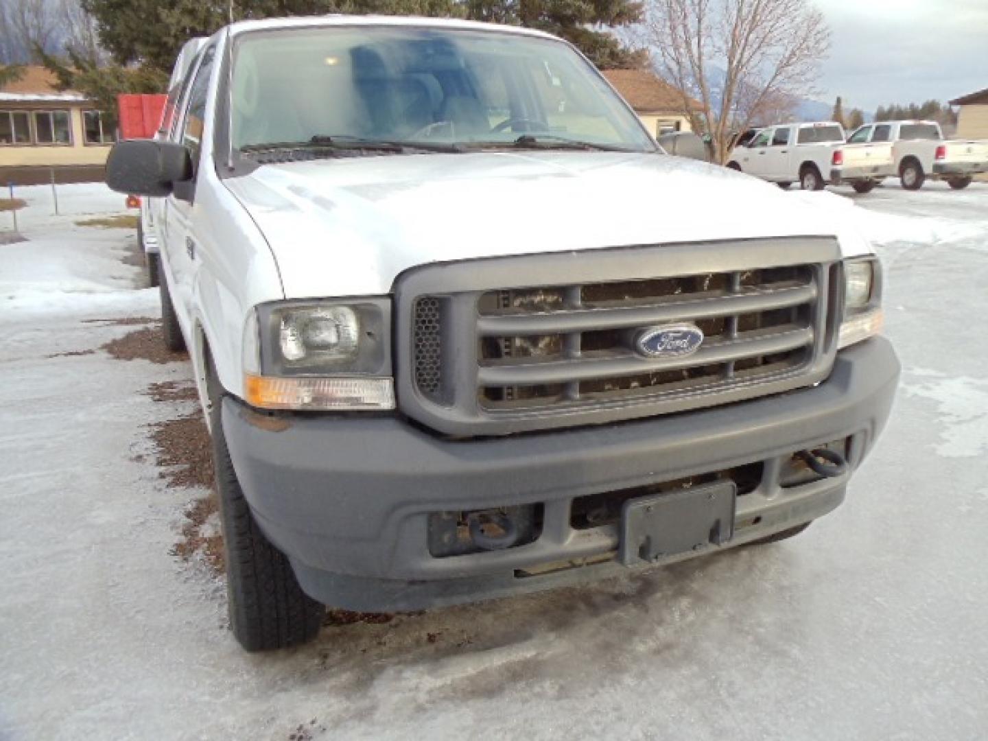 2004 Gray /Gray Ford F-350 SD XL Crew Cab 4WD (1FTSW31L04E) with an 5.4L V8 SOHC 16V engine, 6 Speed Manual transmission, located at 5465 Highway 2 W., Columbia Falls, MT, 59912, (406) 892-4407, 48.352188, -114.240929 - This truck was previously owned by the federal government so it has been well maintained and taken care of. The truck is clean inside and out with good tires and low actual miles. This is the crew cab long box with the 5.4L V8 gas motor. This vehicle is rare with the 6 speed manual transmission. - Photo#1