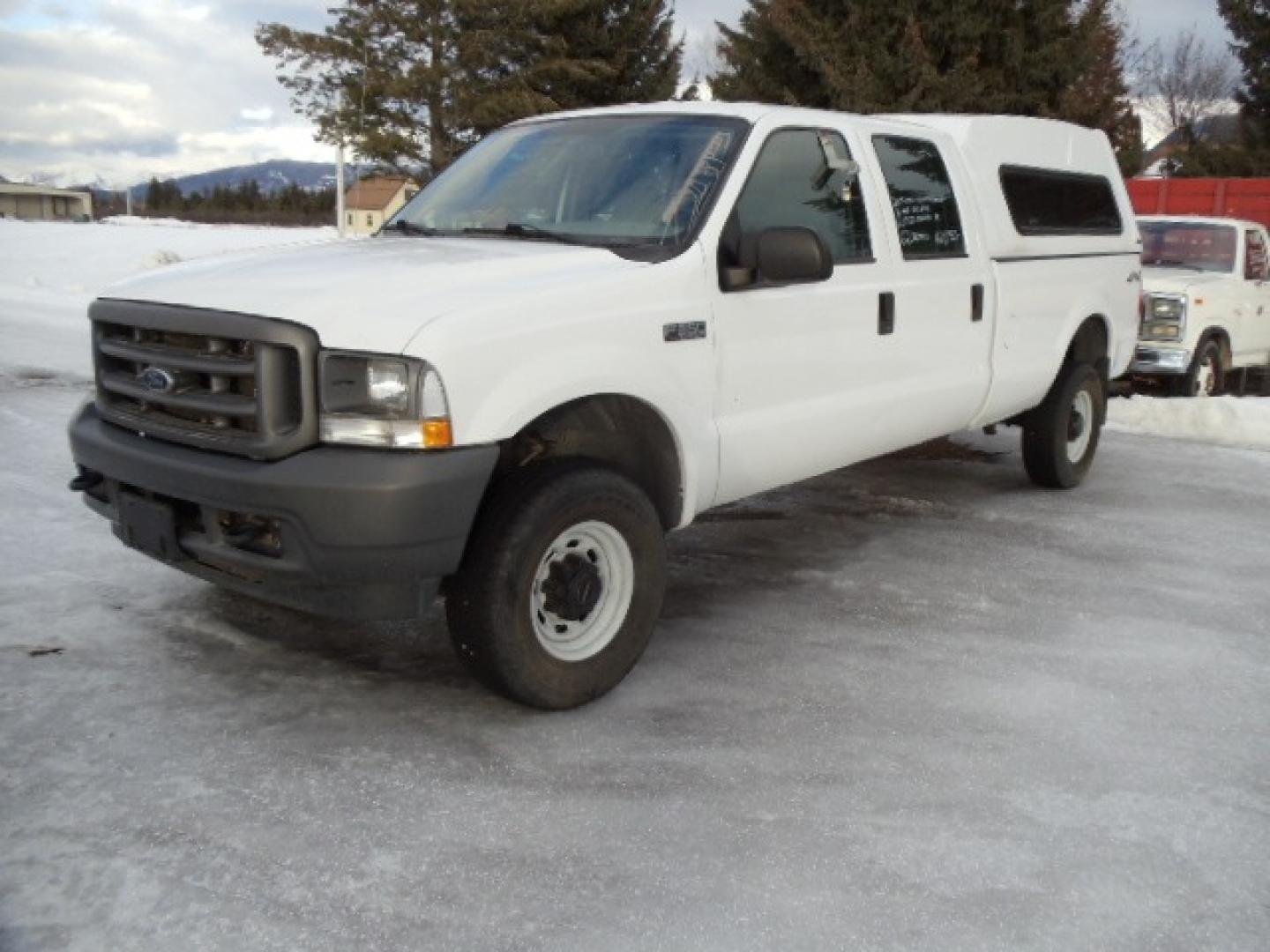 2004 Gray /Gray Ford F-350 SD XL Crew Cab 4WD (1FTSW31L04E) with an 5.4L V8 SOHC 16V engine, 6 Speed Manual transmission, located at 5465 Highway 2 W., Columbia Falls, MT, 59912, (406) 892-4407, 48.352188, -114.240929 - This truck was previously owned by the federal government so it has been well maintained and taken care of. The truck is clean inside and out with good tires and low actual miles. This is the crew cab long box with the 5.4L V8 gas motor. This vehicle is rare with the 6 speed manual transmission. - Photo#2