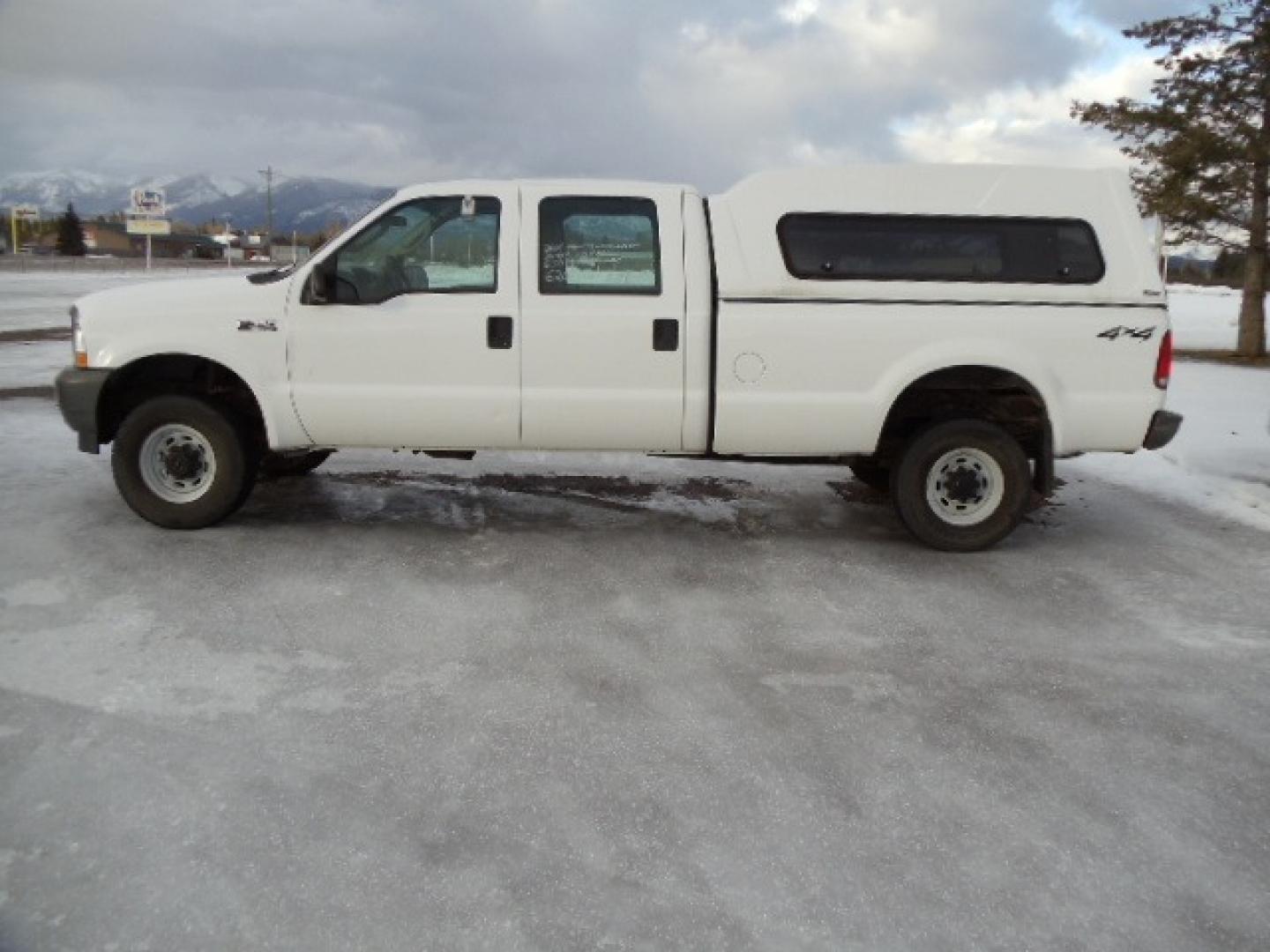 2004 Gray /Gray Ford F-350 SD XL Crew Cab 4WD (1FTSW31L04E) with an 5.4L V8 SOHC 16V engine, 6 Speed Manual transmission, located at 5465 Highway 2 W., Columbia Falls, MT, 59912, (406) 892-4407, 48.352188, -114.240929 - This truck was previously owned by the federal government so it has been well maintained and taken care of. The truck is clean inside and out with good tires and low actual miles. This is the crew cab long box with the 5.4L V8 gas motor. This vehicle is rare with the 6 speed manual transmission. - Photo#3