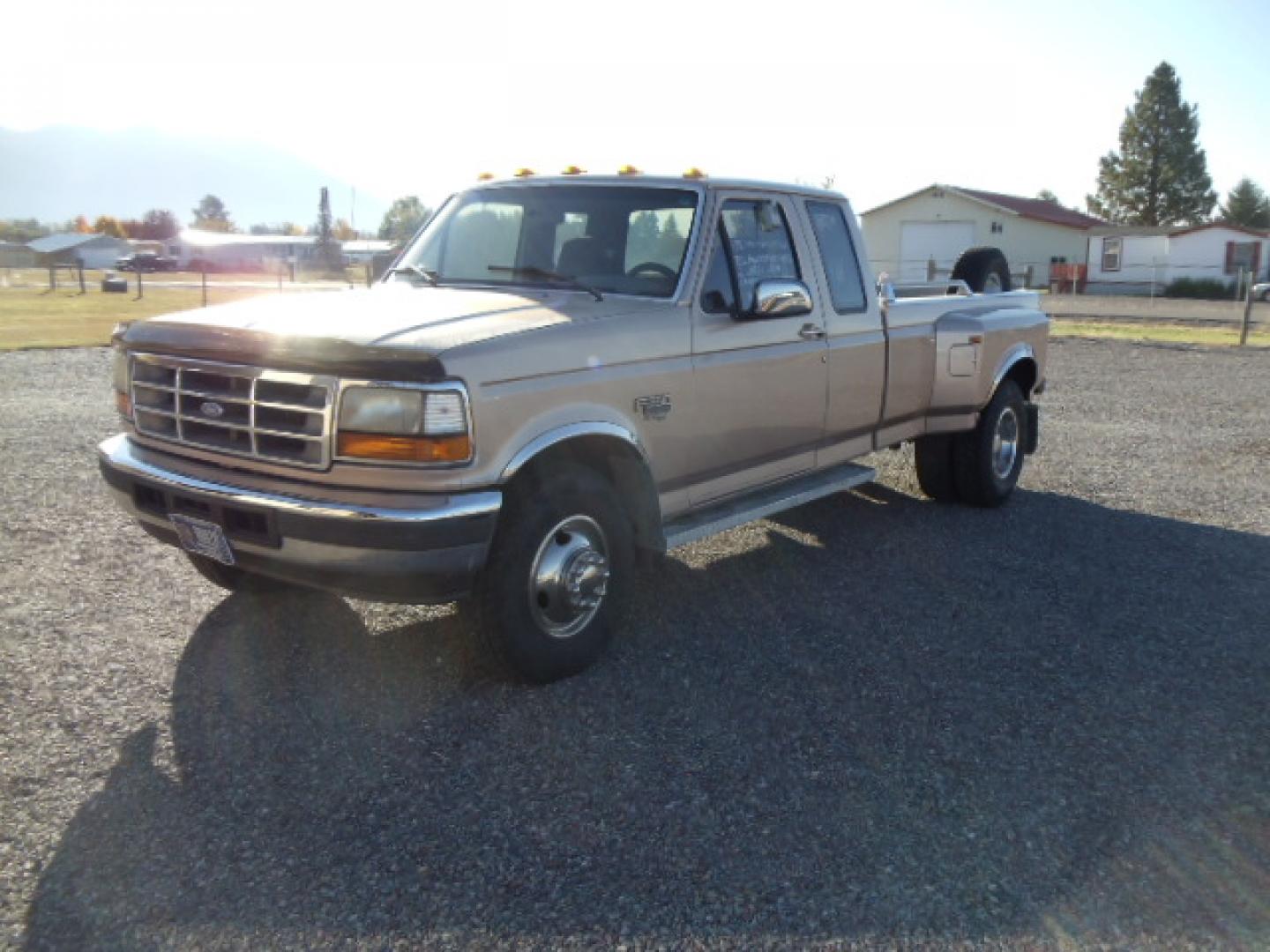 1996 /Tan Ford F-350 XLT SuperCab DRW 2WD (1FTJX35F1TE) with an 7.3L V8 OHV 16V TURBO DIESEL engine, Automatic transmission, located at 5465 Highway 2 W., Columbia Falls, MT, 59912, (406) 892-4407, 48.352188, -114.240929 - Photo#3