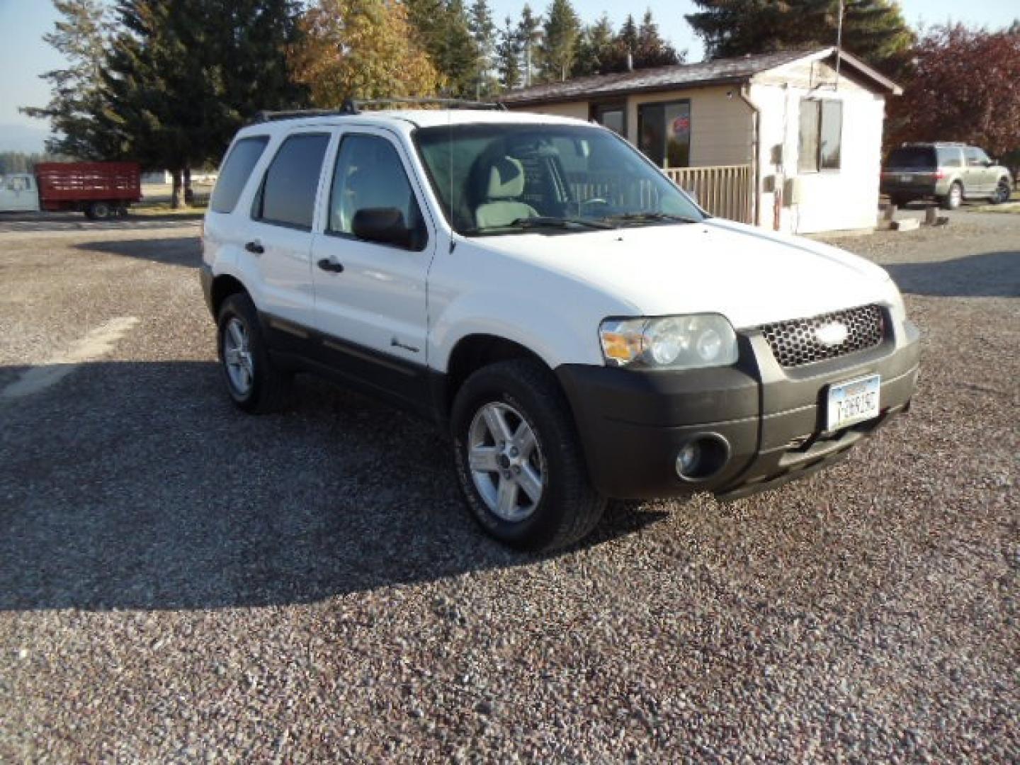 2006 White /Gray Ford Escape Hybrid (1FMYU96H46K) with an L4, 2.3L; AC engine, CVT Automatic transmission, located at 5465 Highway 2 W., Columbia Falls, MT, 59912, (406) 892-4407, 48.352188, -114.240929 - Cruise control AC CD Tilt wheel Power windows door locks and mirrors Brand new tires - Photo#0