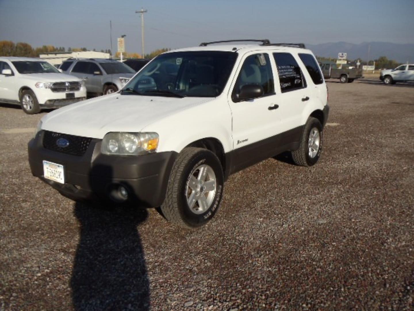 2006 White /Gray Ford Escape Hybrid (1FMYU96H46K) with an L4, 2.3L; AC engine, CVT Automatic transmission, located at 5465 Highway 2 W., Columbia Falls, MT, 59912, (406) 892-4407, 48.352188, -114.240929 - Cruise control AC CD Tilt wheel Power windows door locks and mirrors Brand new tires - Photo#2