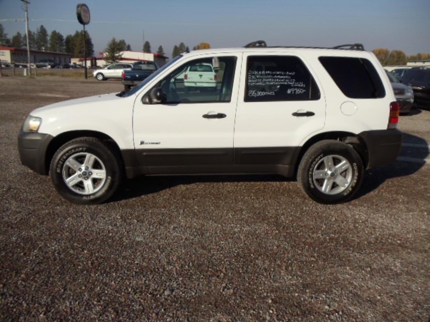 2006 White /Gray Ford Escape Hybrid (1FMYU96H46K) with an L4, 2.3L; AC engine, CVT Automatic transmission, located at 5465 Highway 2 W., Columbia Falls, MT, 59912, (406) 892-4407, 48.352188, -114.240929 - Cruise control AC CD Tilt wheel Power windows door locks and mirrors Brand new tires - Photo#3