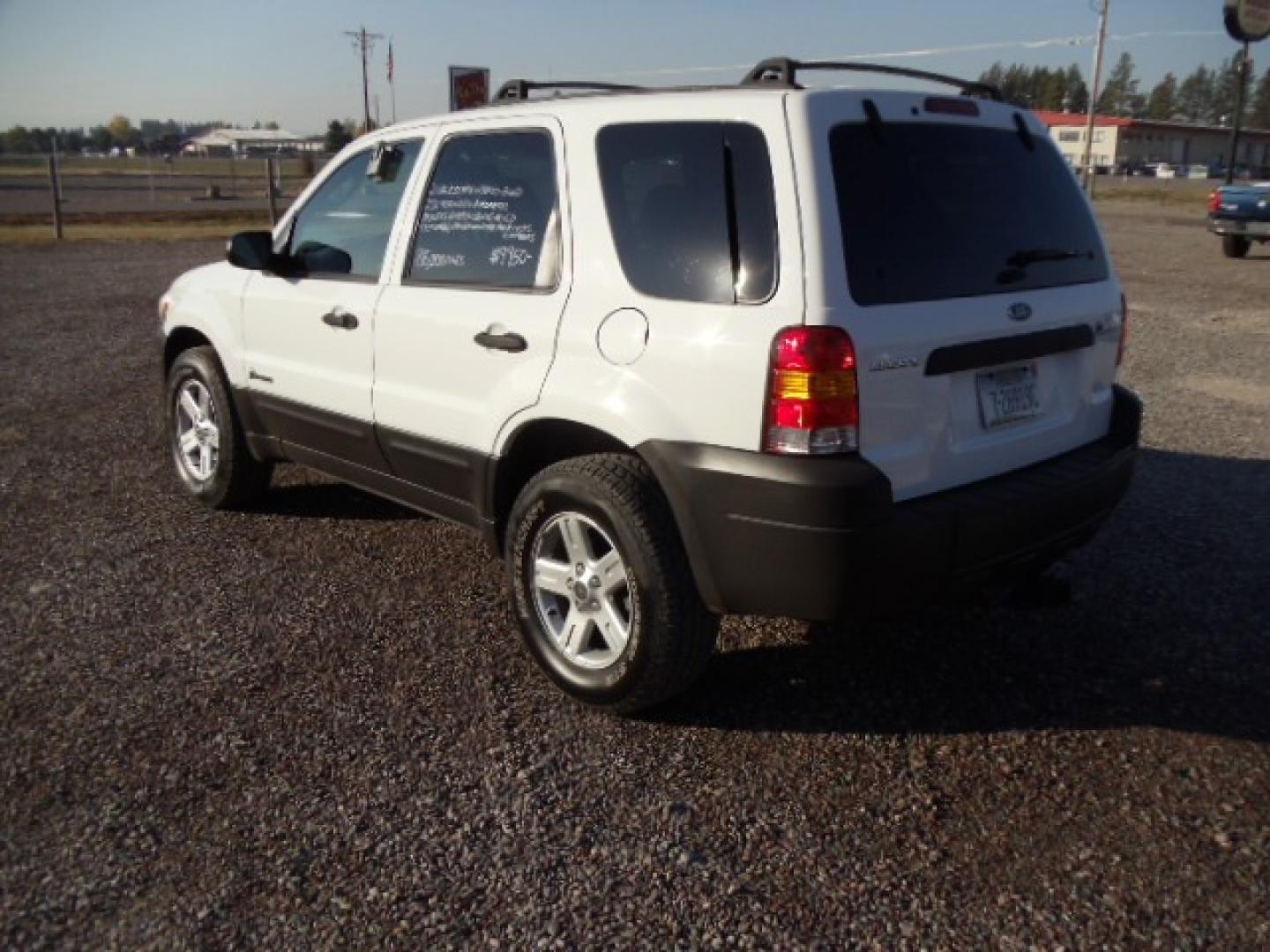 2006 White /Gray Ford Escape Hybrid (1FMYU96H46K) with an L4, 2.3L; AC engine, CVT Automatic transmission, located at 5465 Highway 2 W., Columbia Falls, MT, 59912, (406) 892-4407, 48.352188, -114.240929 - Cruise control AC CD Tilt wheel Power windows door locks and mirrors Brand new tires - Photo#4